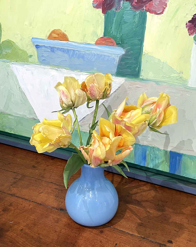 Tulips in front of a Roger Muhl painting