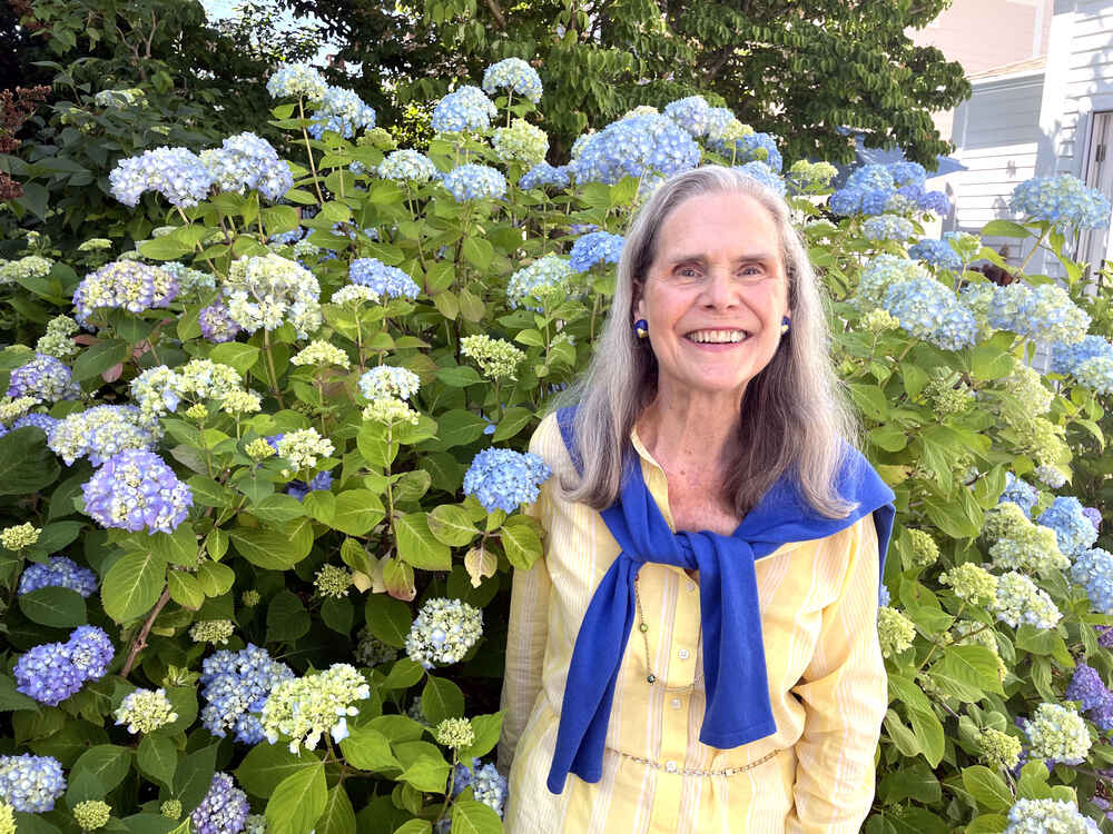 Alexandra surrounded by hydrangea