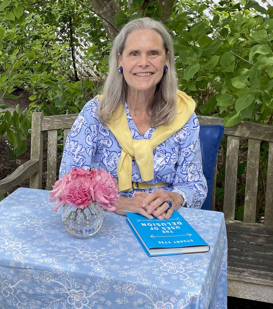 Alexandra at a desk in the garden