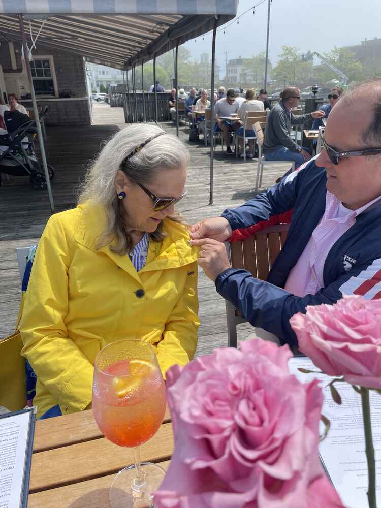 Matt pinning a star on Alexandra's lapel