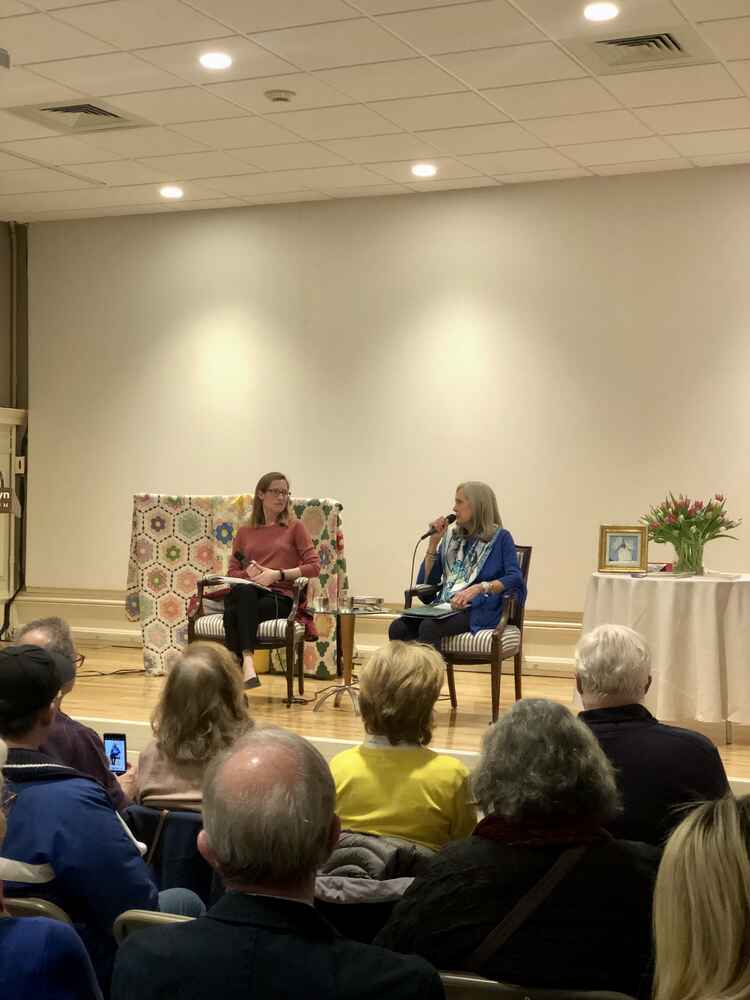 Tanya and Alexandra on stage in front of an audience