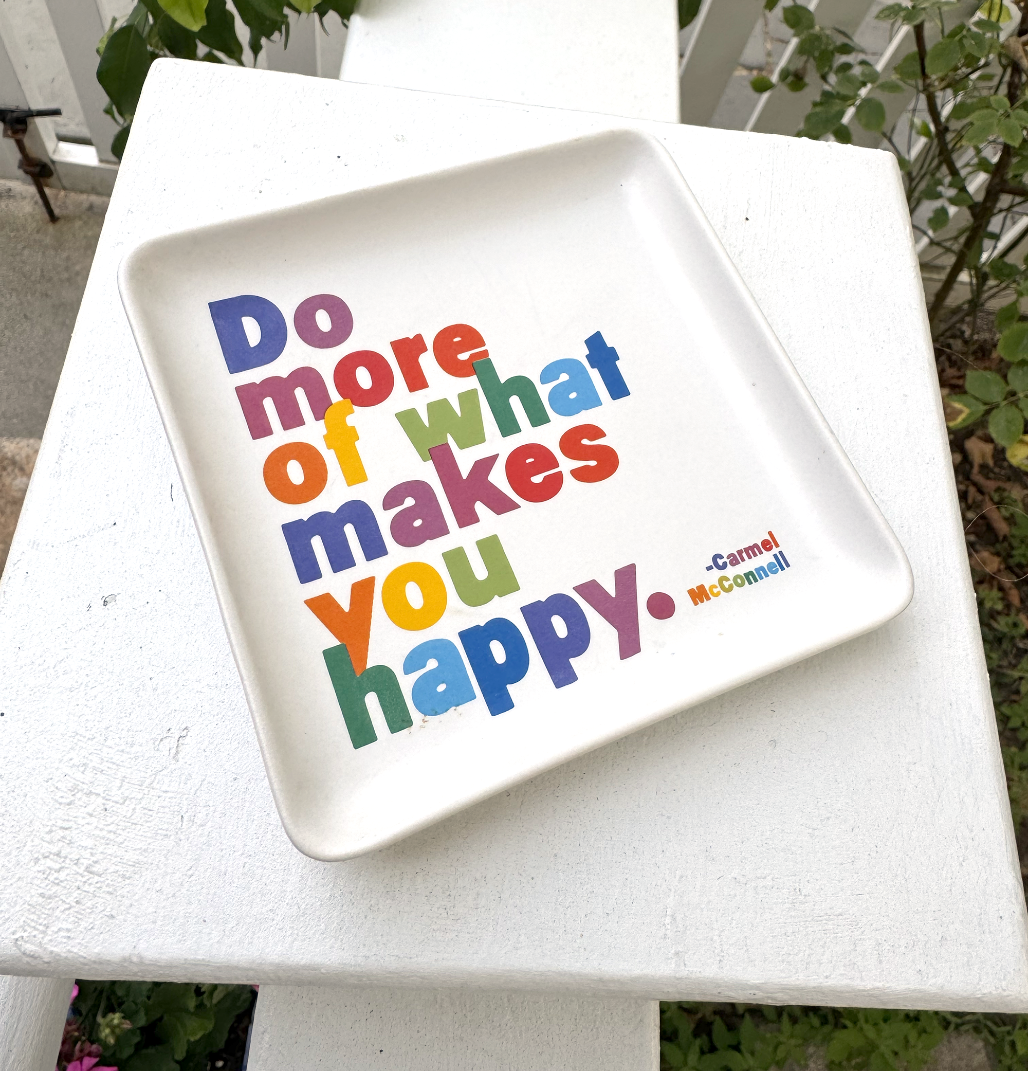 A square dish that reads 